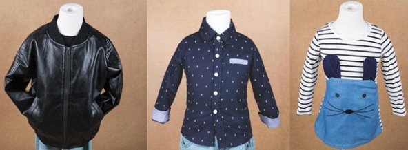 Children's garments on display forms: a black zip-front jacket, a navy polka-dot button shirt and a striped long-sleeve top with a cat-face pocket panel