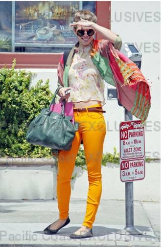 Annalynne McCord wearing Earnest Sewn orange jeans
