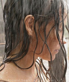 Evangeline Lily playing Kate on Lost.  Caught in the Rain.. She was in the jail cell when captive on the Island.