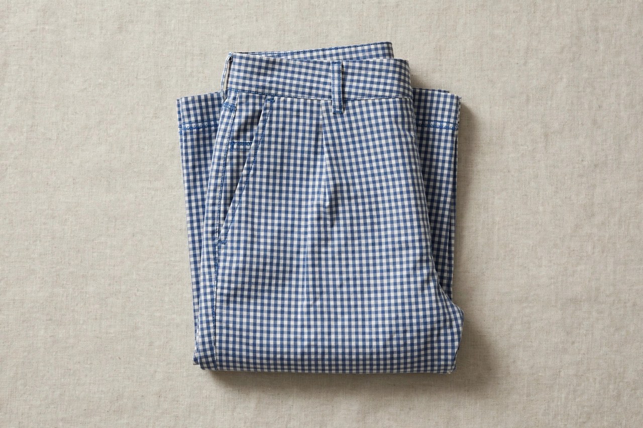 Neatly folded womens cotton gingham pants with a crisp white and color woven check pattern
