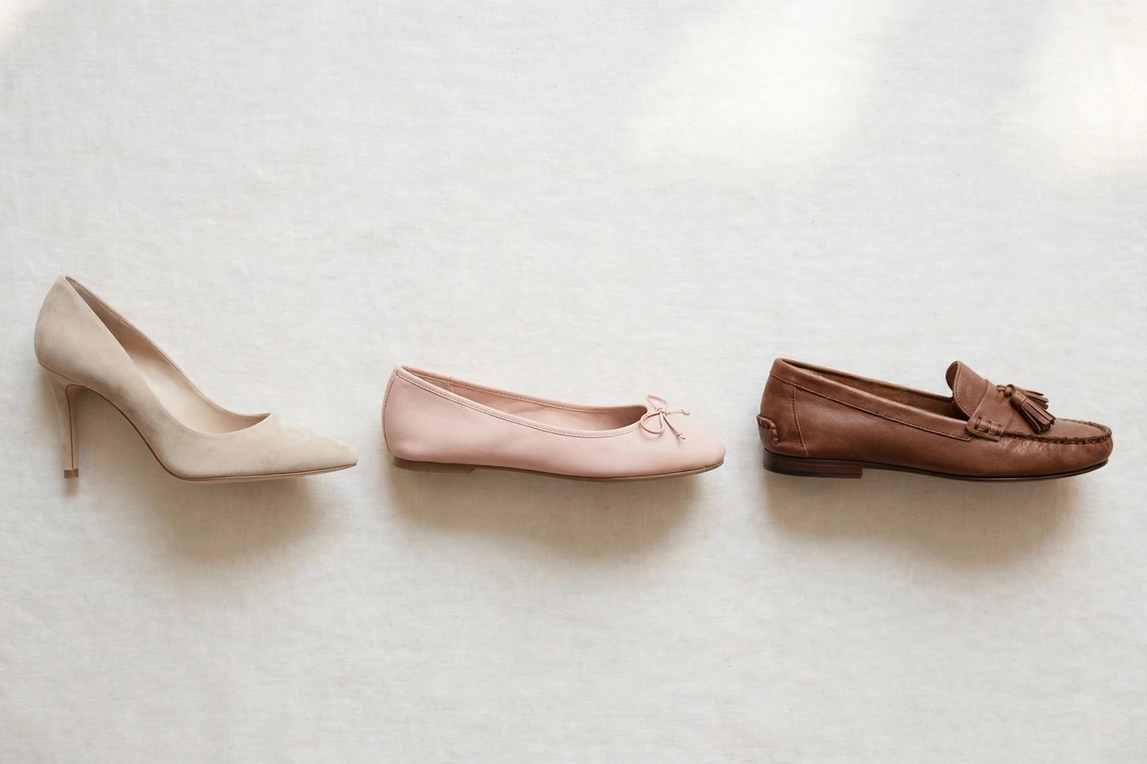 Women's shoes in several styles including pumps, ballet flats and loafers arranged in a row