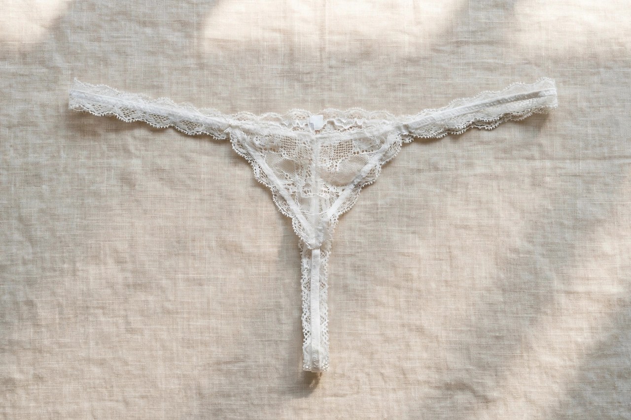 Women's thong underwear shown as a flat lay product photograph, garment only, no people