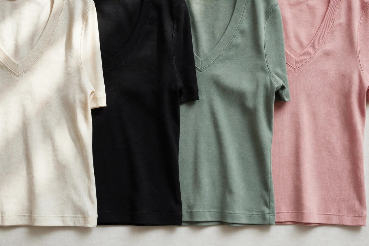 Women's v-neck tops laid flat as a product photograph showing fabric and construction details