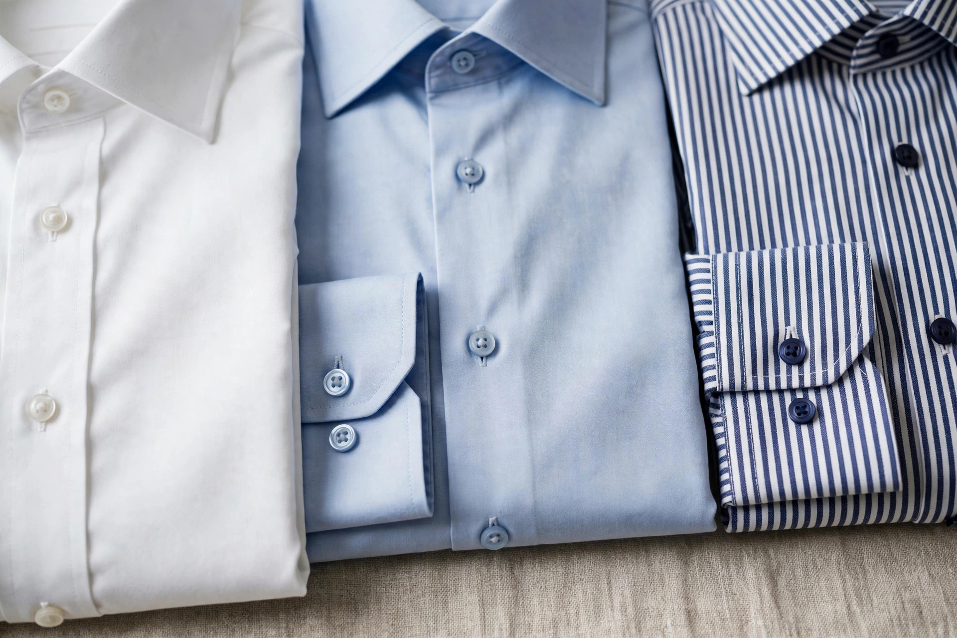 Crisp light blue poplin shirting fabric with a smooth fine rib