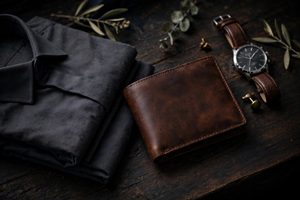 Masculine gift arrangement with leather wallet, wristwatch and dress shirt
