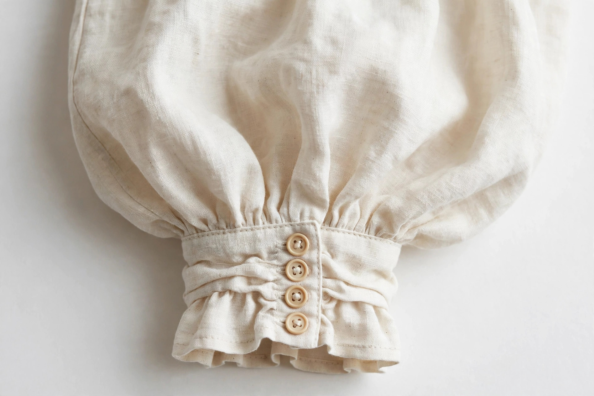 Close-up of a full balloon sleeve gathered into a cuff on a blouse