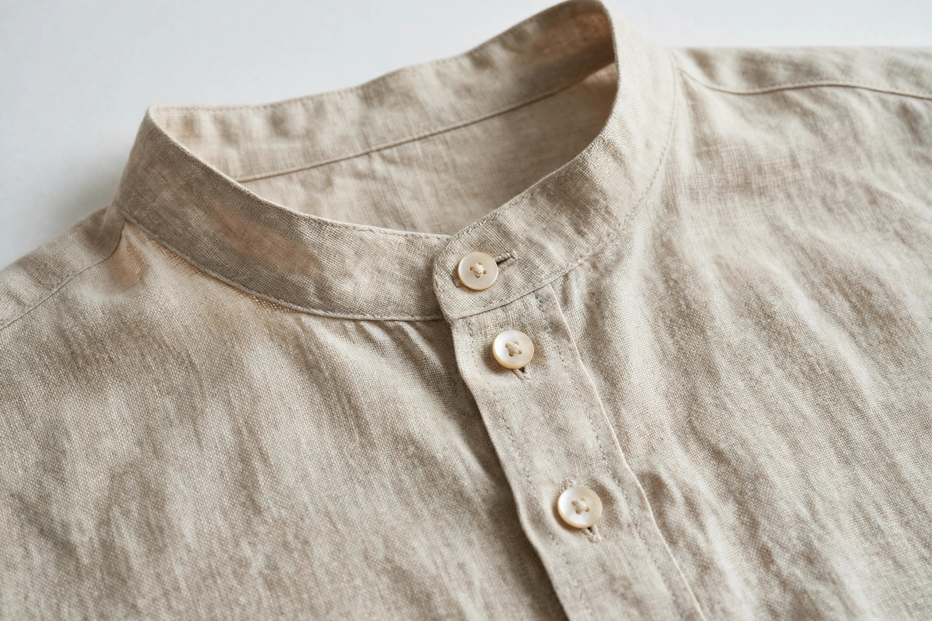 Close-up of a simple band collar on a linen grandad shirt
