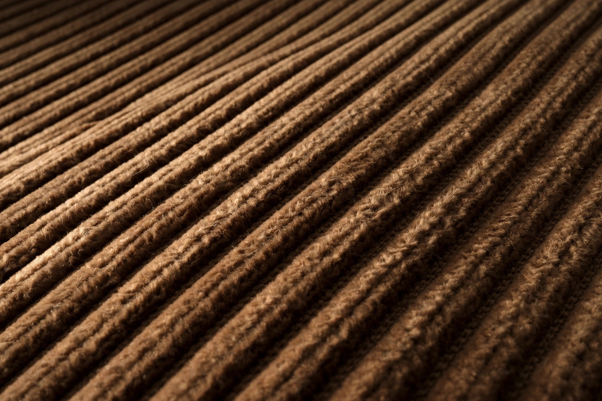 Brown corduroy fabric showing raised parallel wales