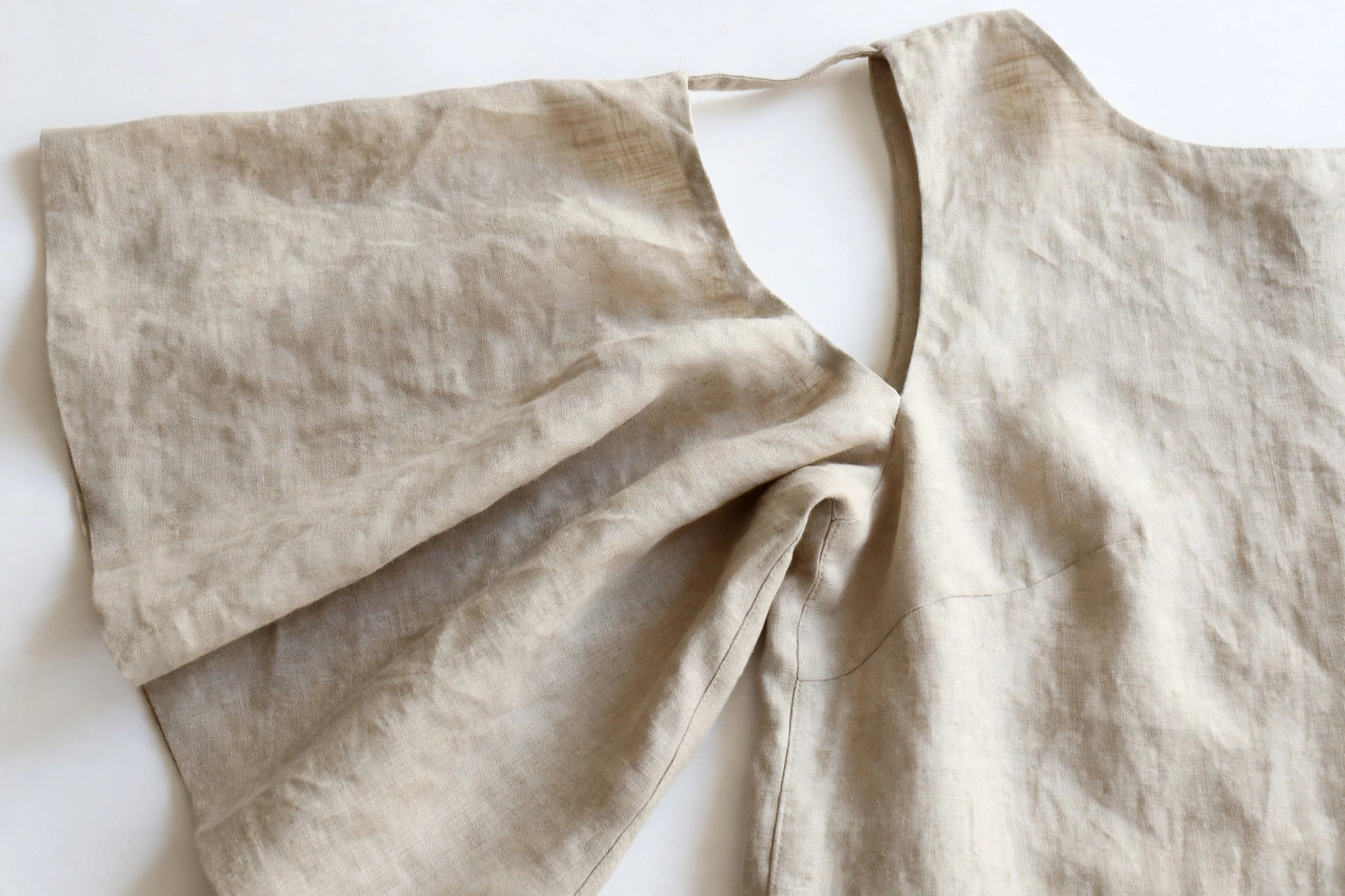 Close-up of a dolman sleeve cut in one piece with the bodice, wide at the armhole