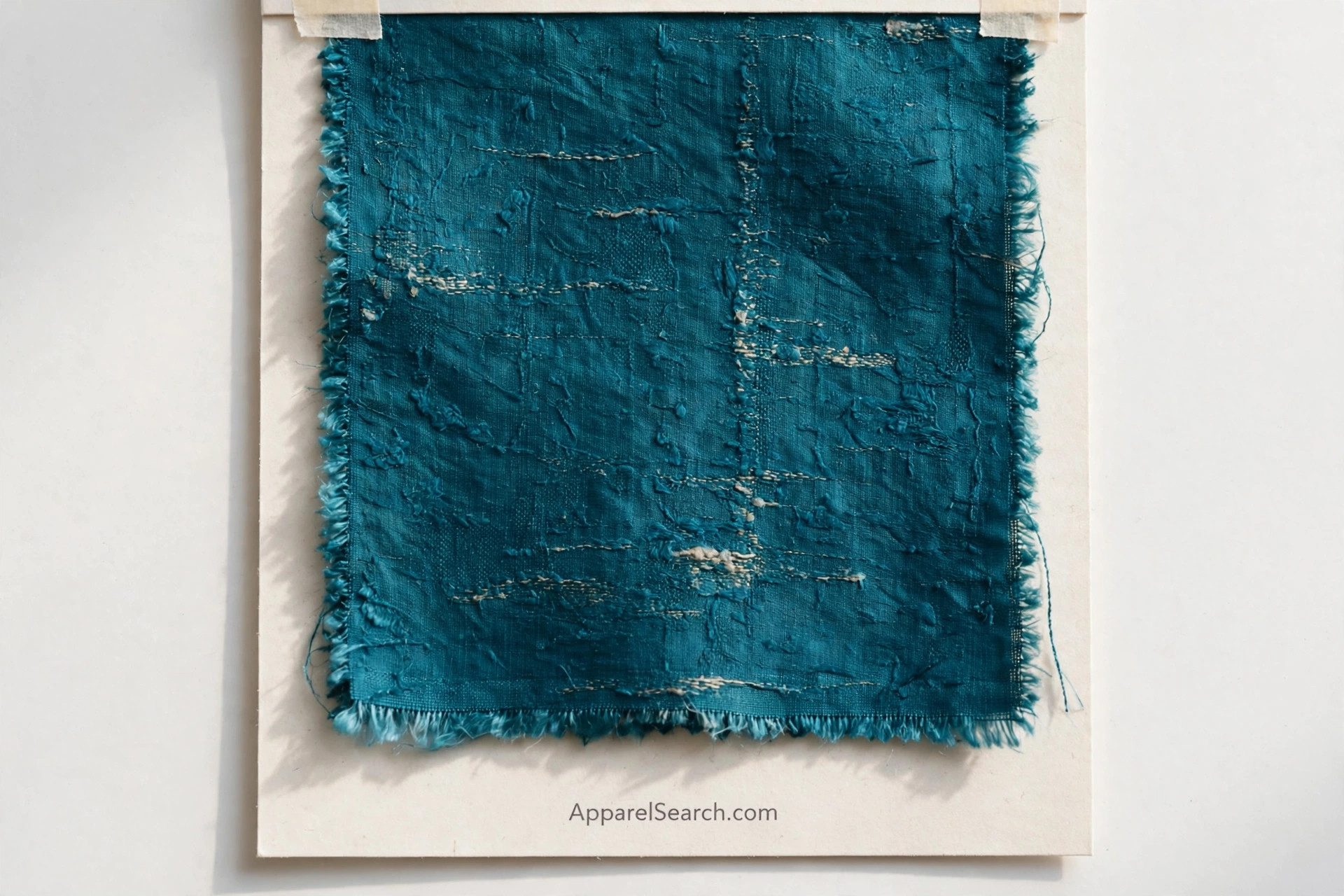 Rich teal dupioni silk fabric swatch with visible natural slubs, on a swatch card labelled ApparelSearch.com