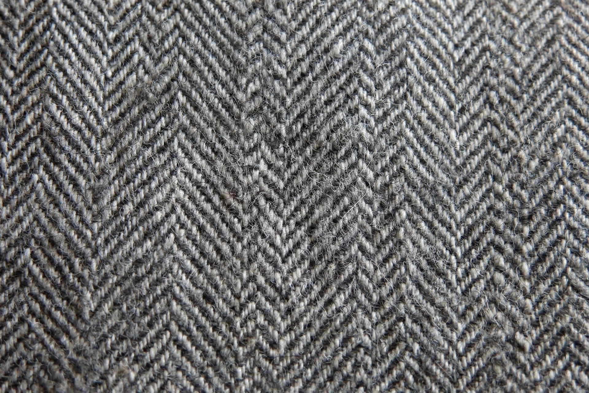 Gray wool herringbone fabric with a zigzag twill pattern