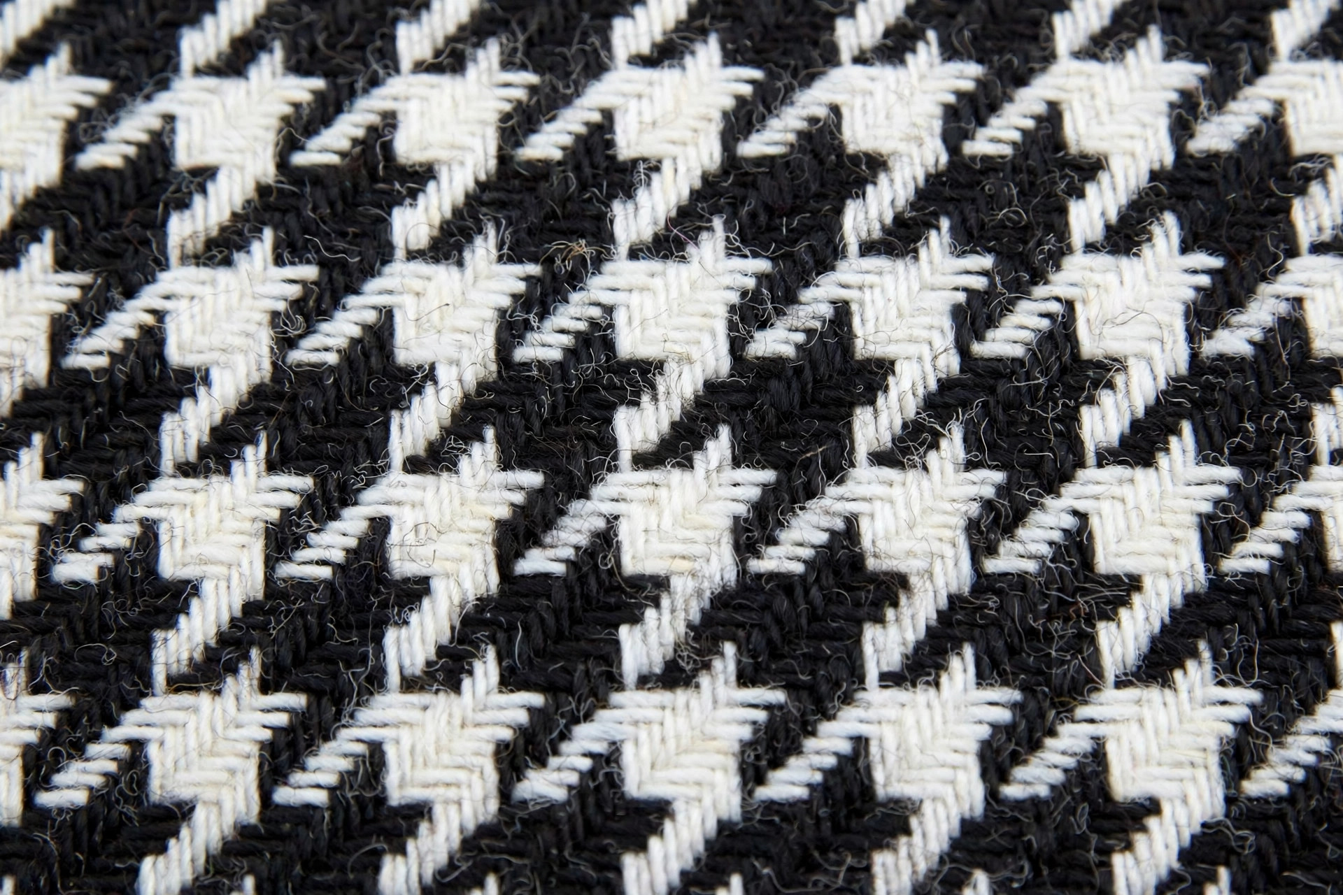 Black and white houndstooth check fabric pattern