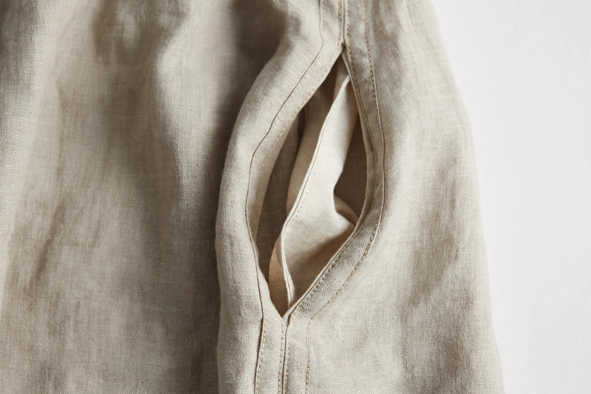 Close-up showing a hidden in-seam pocket in the side seam of a dress