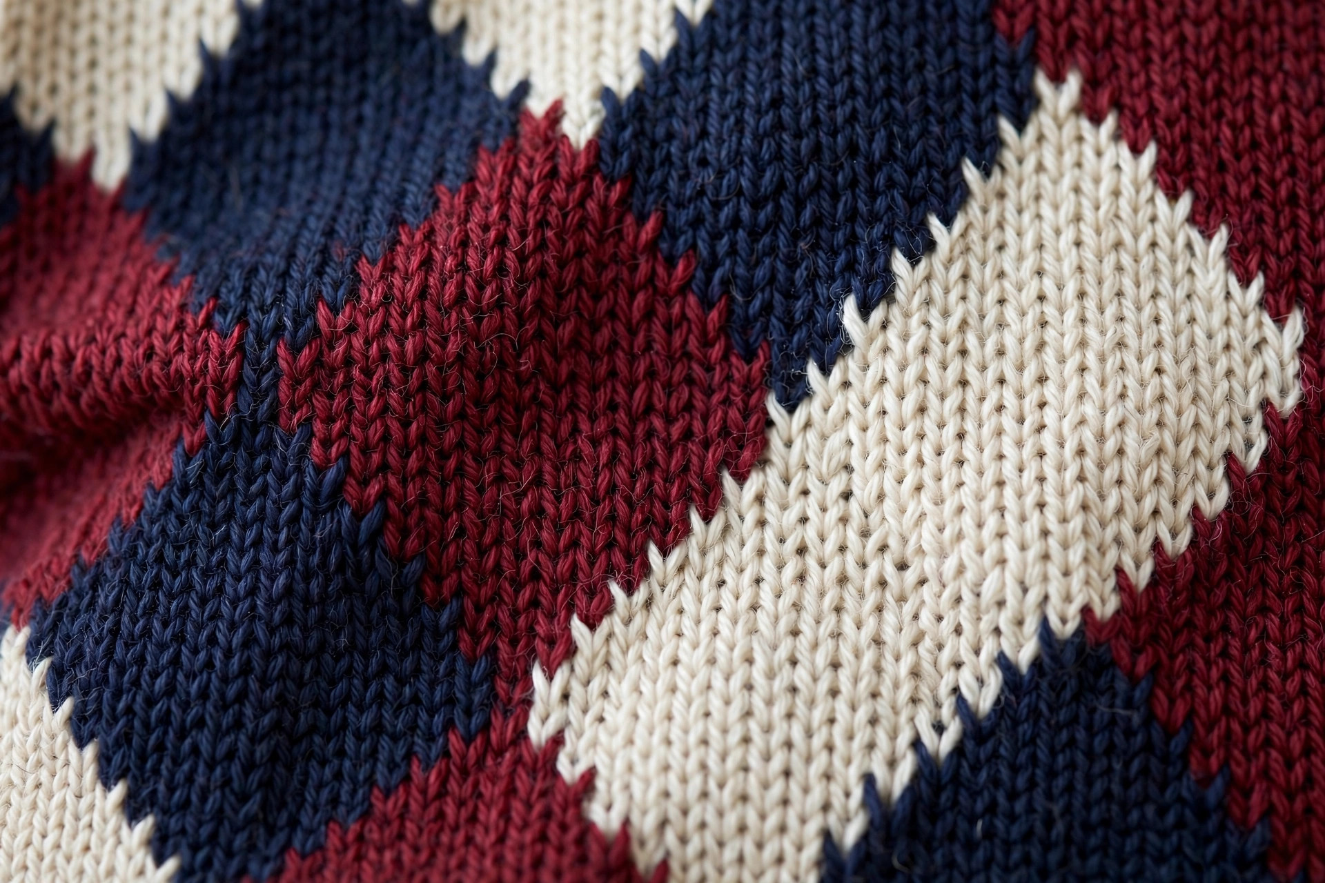 Intarsia knit sweater with bold color-block diamond pattern