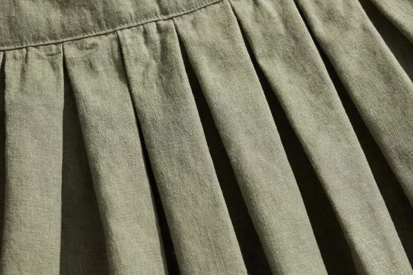 Sharp knife pleats in a skirt