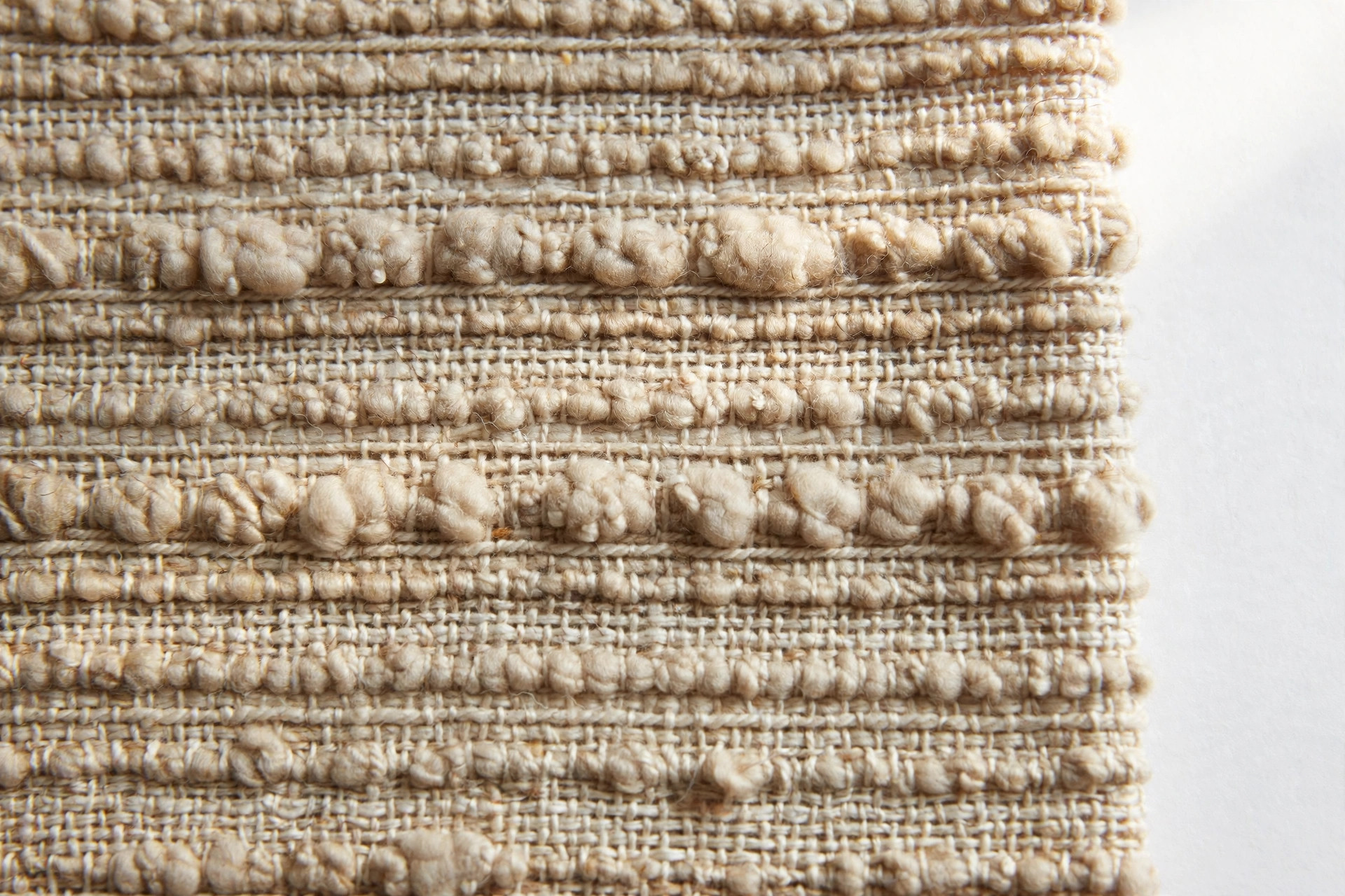 Close-up of slub yarn fabric showing thick and thin places in the yarn creating textured stripes