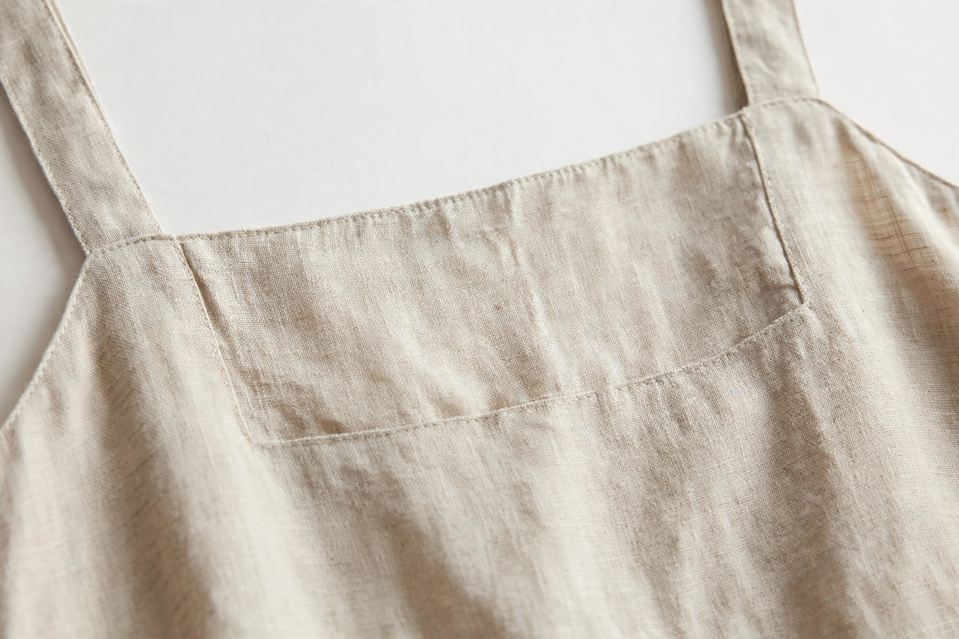 Close-up of a square neckline on a linen summer dress
