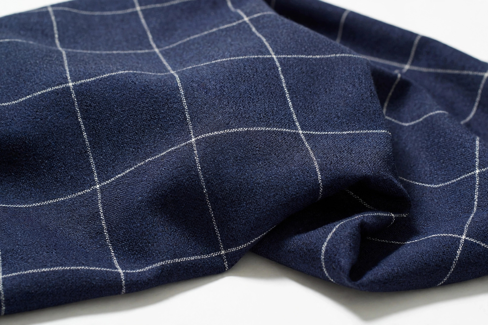 Navy suiting fabric with large windowpane check of thin white lines