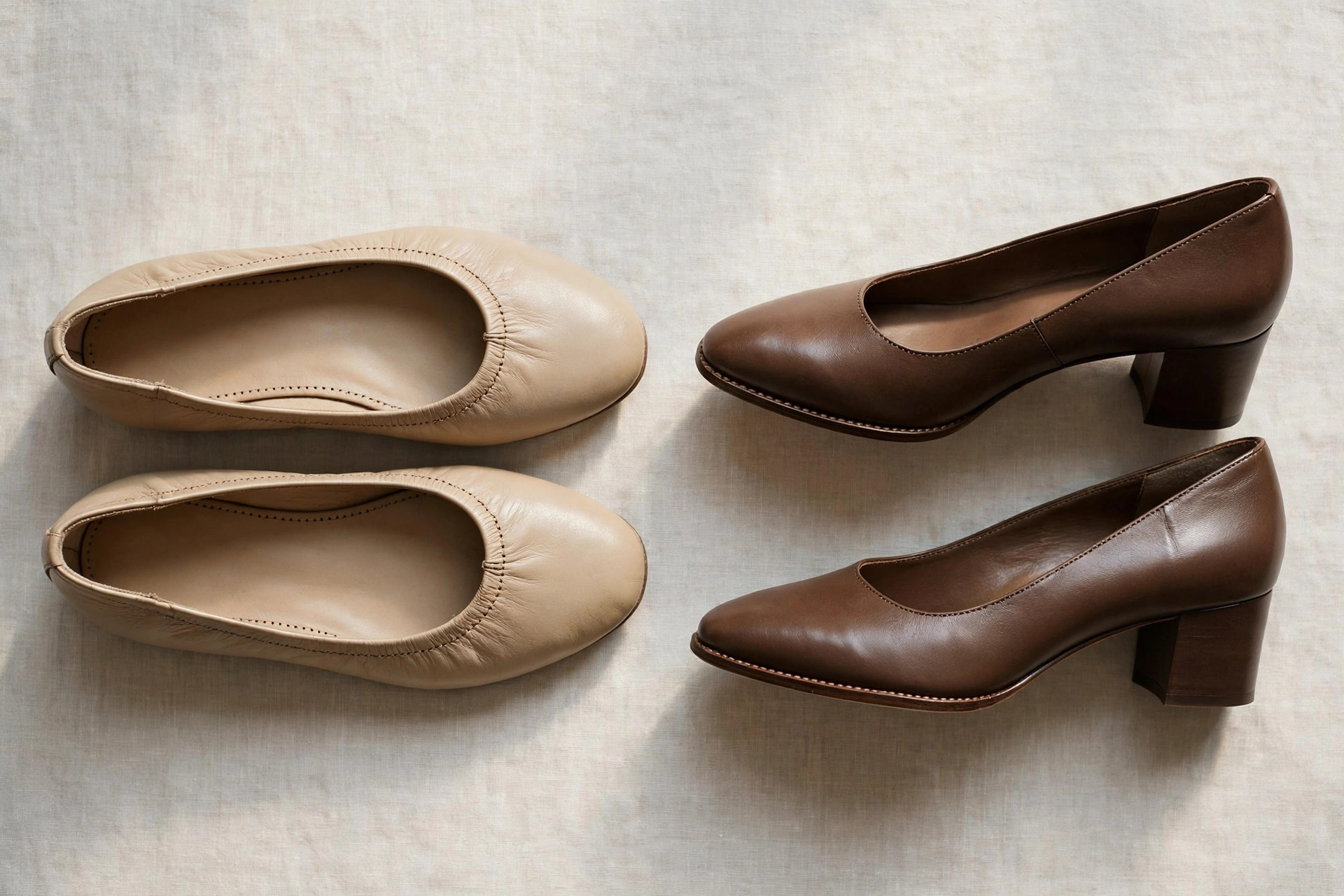 Women's leather ballet flats and low block-heel pumps arranged on a neutral background