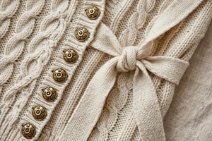 Women's sweater with decorative buttons and tie front details